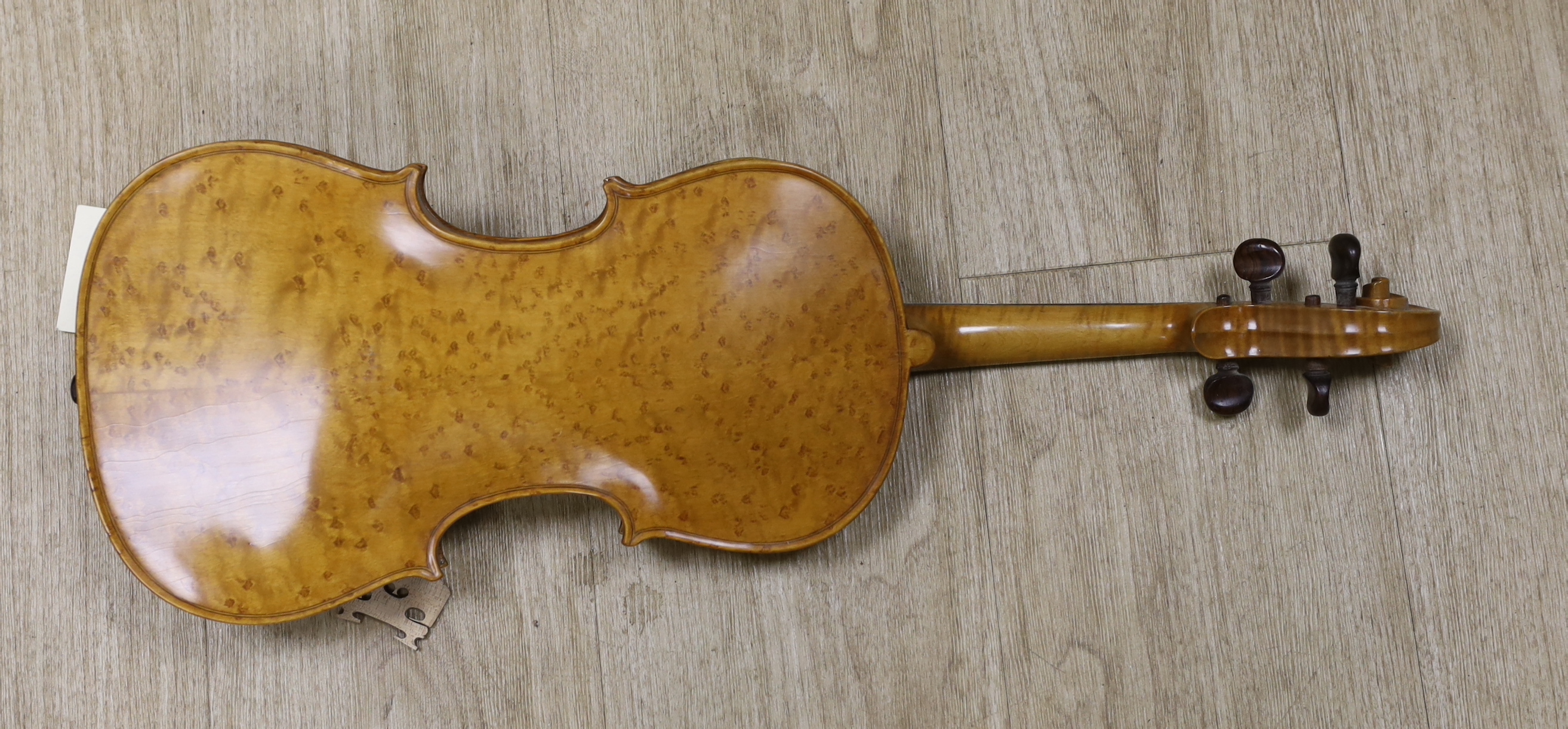 A bird's eye maple veneered student's violin